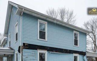 Freeze-thaw cycle causing cracks and moisture damage in exterior home siding