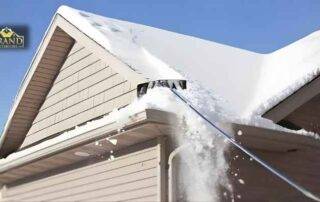 Snow accumulation and ice dams adding heavy load on a residential roof during winter